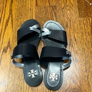 Black and silver Tory Burch sandals.